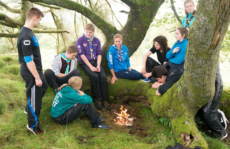 Scouts and Explorers around campfire